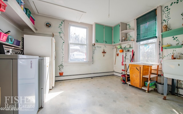 interior space with washer / dryer and a baseboard radiator