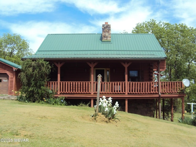 70 Berry Ln, Mill Hall, PA 17751 - view of front facade with a standing seam roof, a chimney, a front yard, and metal roof
