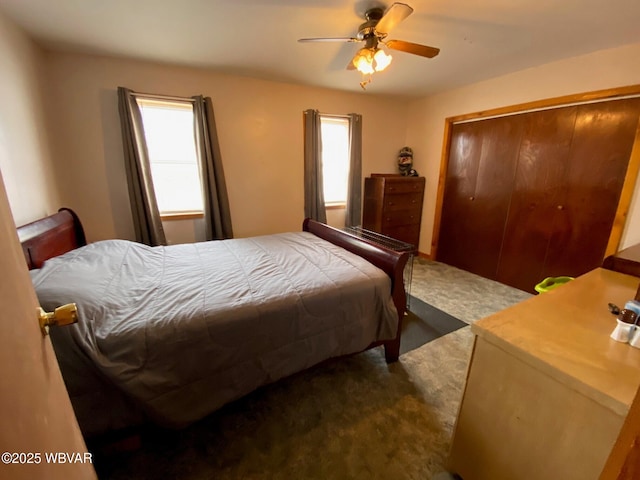 bedroom with a closet, carpet floors, and a ceiling fan