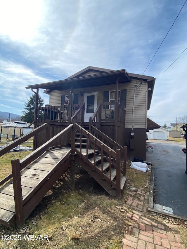 back of property with stairs