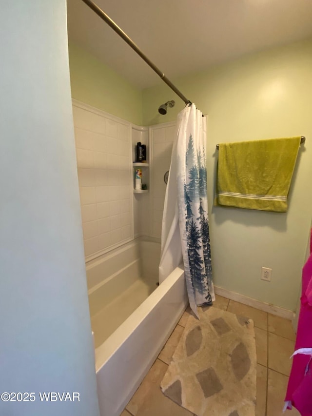 bathroom featuring tile patterned flooring, shower / bathtub combination with curtain, and baseboards