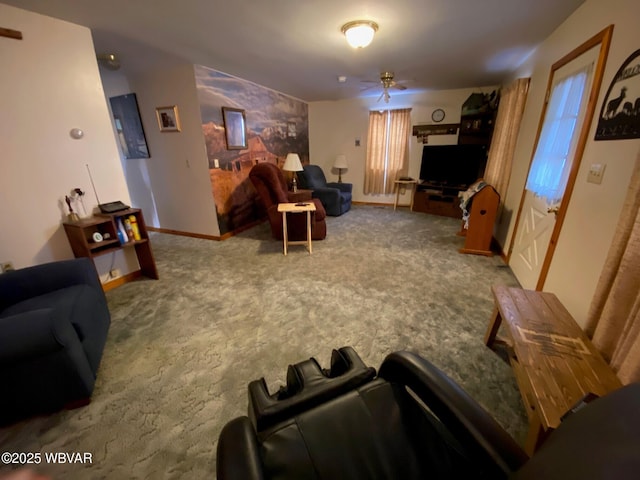 living room featuring baseboards, ceiling fan, and carpet floors