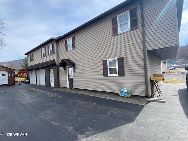 view of property exterior with a garage