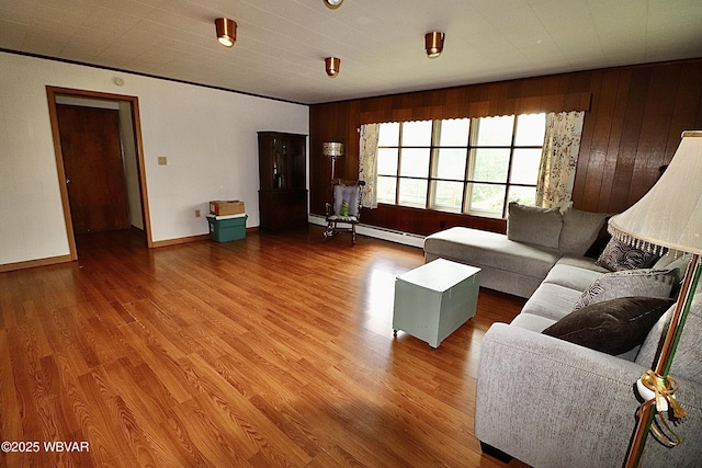 1964 Poco Farm Rd, Williamsport, PA 17701 - living room featuring wood finished floors, wood walls, baseboards, and a baseboard heating unit
