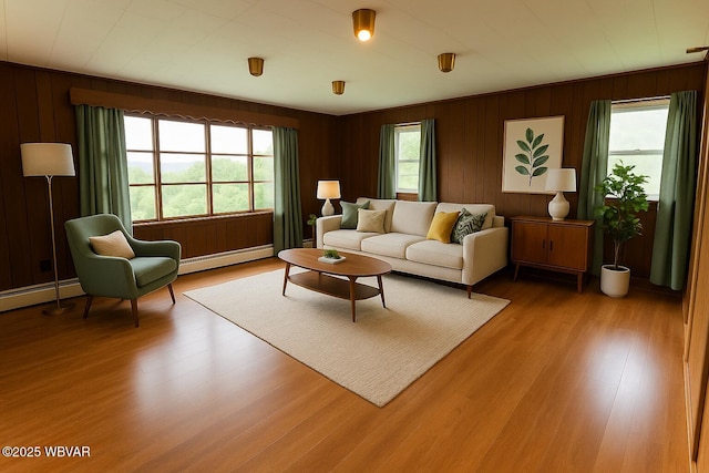 1964 Poco Farm Rd, Williamsport, PA 17701 - living room featuring baseboard heating, wood finished floors, and wood walls