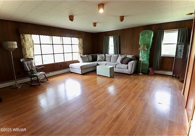 1964 Poco Farm Rd, Williamsport, PA 17701 - living area with baseboard heating, wood finished floors, and wooden walls