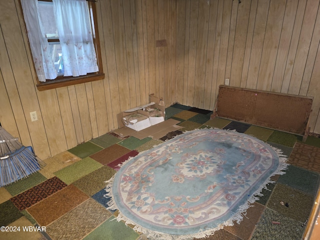 bedroom with wood walls