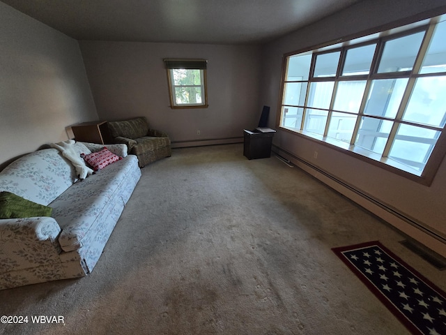 living room with baseboard heating and carpet floors