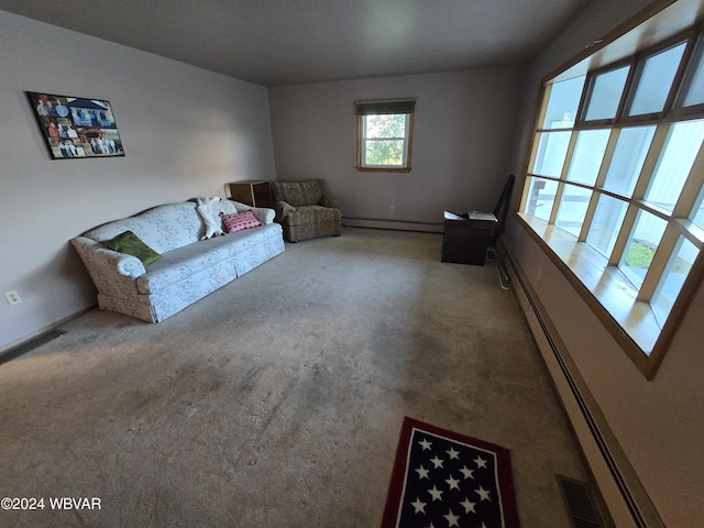 unfurnished room featuring carpet flooring and a baseboard radiator