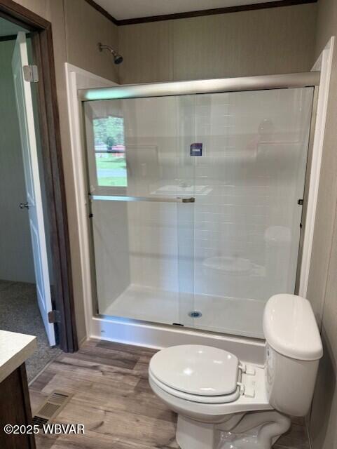 2381 Rt 405th Hwy, Muncy, PA 17756 - full bathroom with vanity, a shower stall, ornamental molding, and wood finished floors