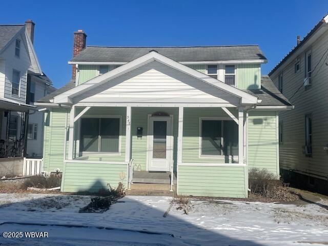 bungalow-style house featuring covered porch