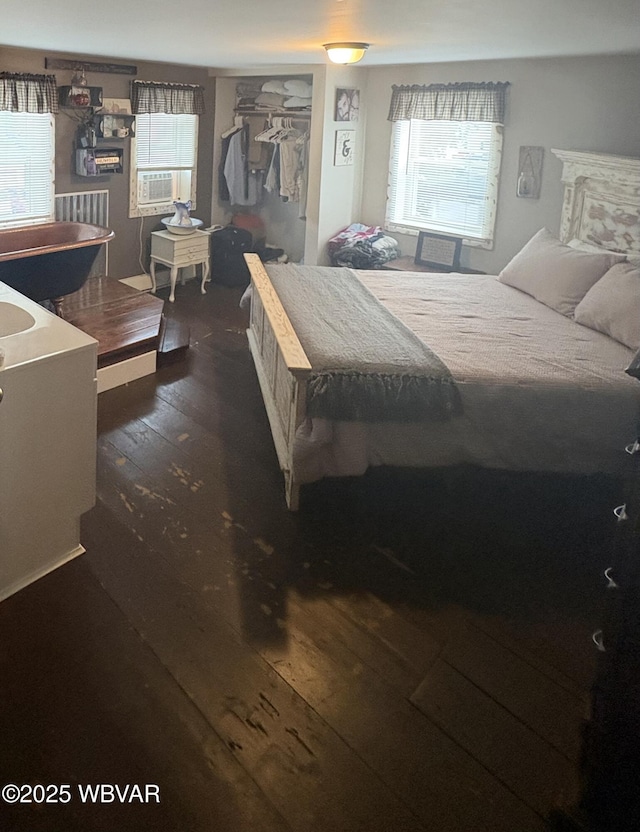 433 S Main St, Jersey Shore, PA 17740 - bedroom with wood-type flooring and cooling unit