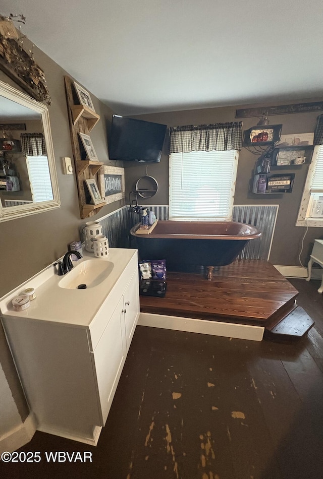 433 S Main St, Jersey Shore, PA 17740 - bathroom featuring a freestanding bath, vanity, and wood finished floors