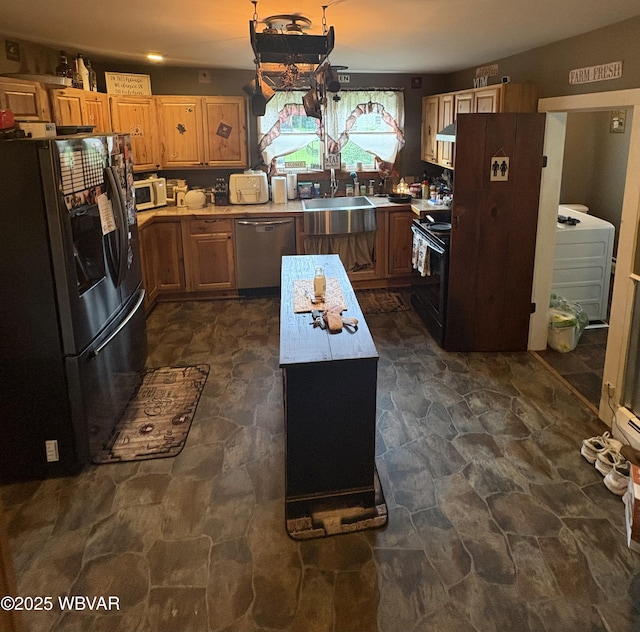 433 S Main St, Jersey Shore, PA 17740 - kitchen featuring black appliances, dark stone finish floors, light countertops, and a kitchen island