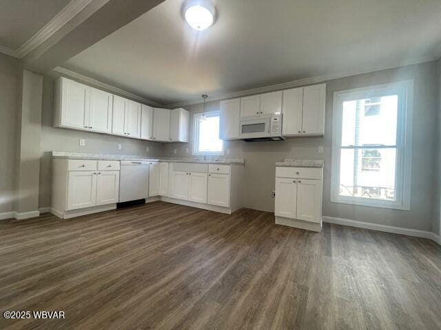 kitchen with baseboards, white appliances, dark wood-type flooring, and white cabinetry