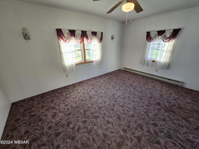 empty room with carpet, ceiling fan, and baseboard heating