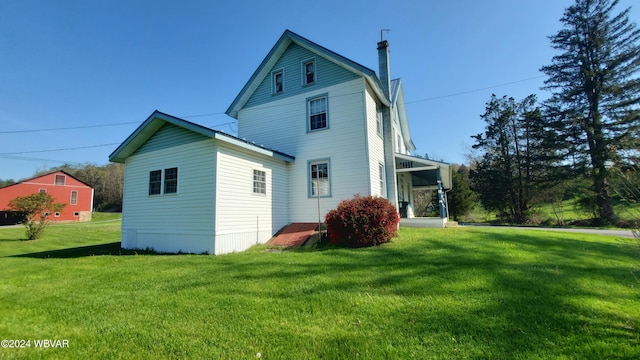 back of house featuring a yard