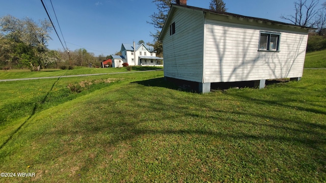 view of home's exterior featuring a yard