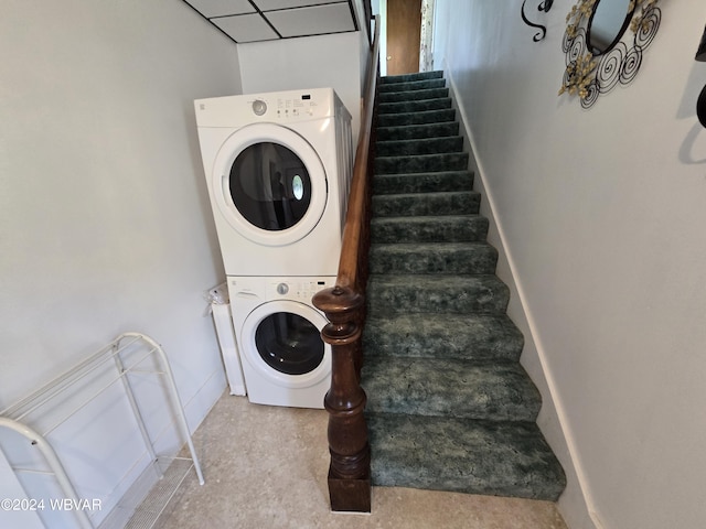 laundry room with stacked washer and clothes dryer