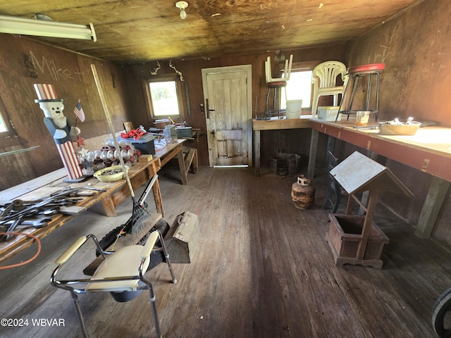 miscellaneous room with wood walls, dark hardwood / wood-style flooring, and wooden ceiling