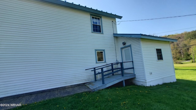 view of home's exterior featuring a lawn