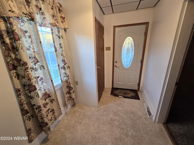 view of carpeted entrance foyer