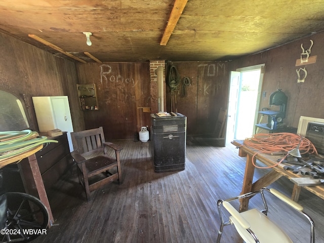 interior space with wooden walls and dark hardwood / wood-style floors