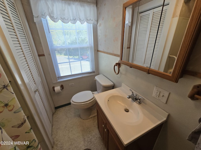 bathroom with vanity and toilet