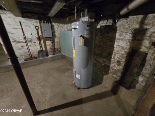 utility room with electric water heater and electric panel