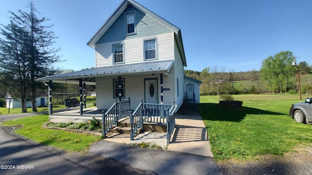 view of front of property with a porch and a front yard