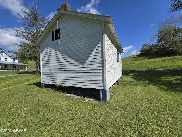 view of property exterior featuring a yard