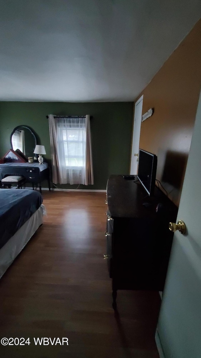 bedroom featuring wood-type flooring