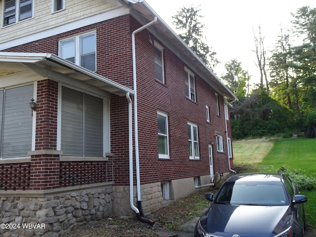 view of home's exterior featuring a yard