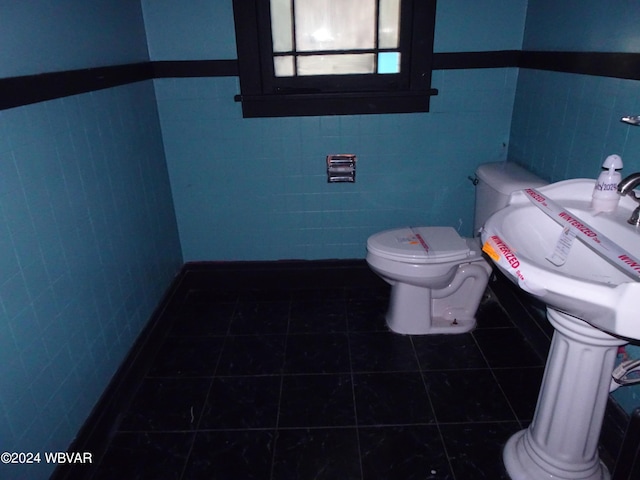5047 Blockhouse Rd, Liberty, PA 16930 - half bathroom with tile walls, tile patterned floors, and wainscoting