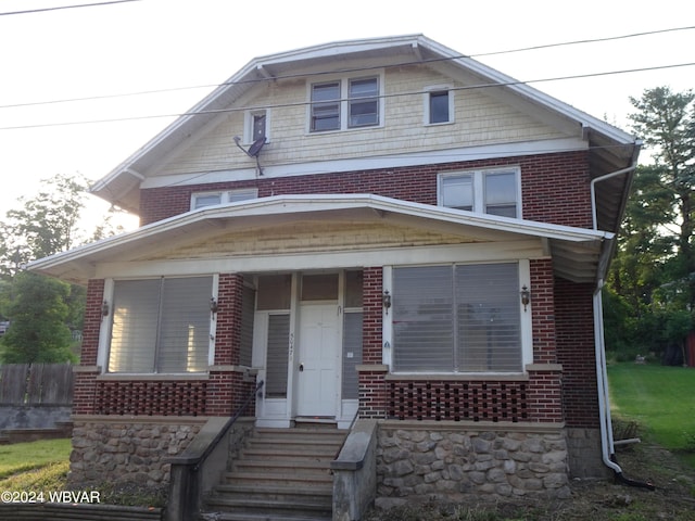 5047 Blockhouse Rd, Liberty, PA 16930 - american foursquare style home with brick siding and covered porch