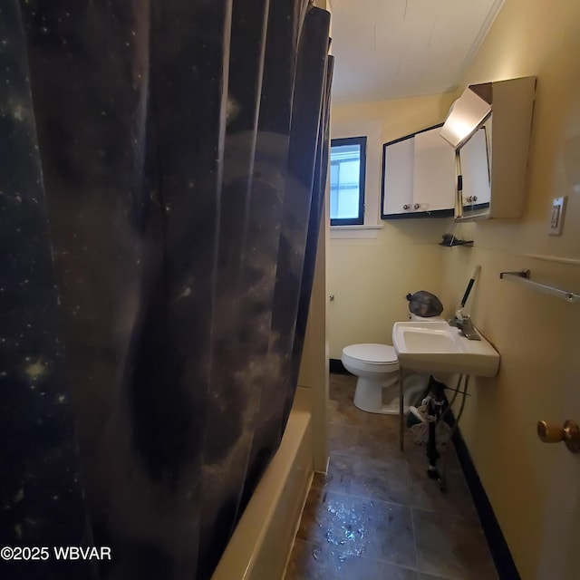 full bathroom featuring shower / bath combo, sink, and toilet