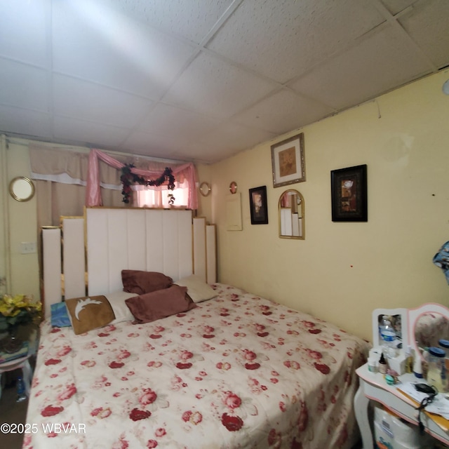 bedroom with a paneled ceiling