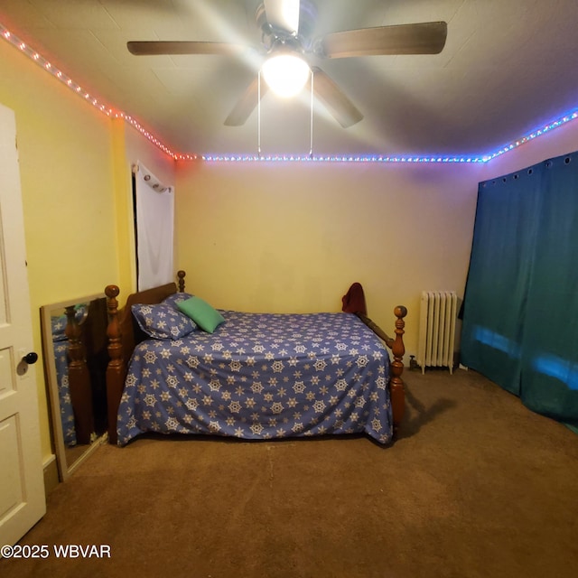 bedroom with radiator heating unit, ceiling fan, and carpet