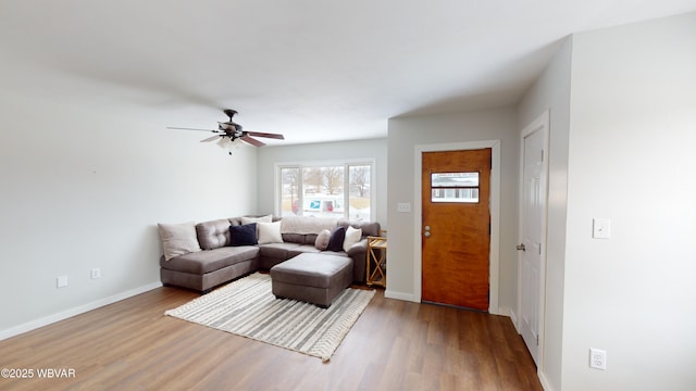 living room with hardwood / wood-style floors and ceiling fan