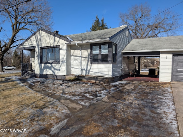 view of home's exterior with a carport