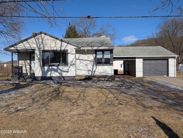 view of front of property with a garage and a front yard