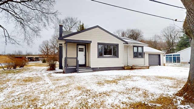 bungalow-style home featuring a garage