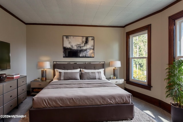 bedroom featuring carpet and crown molding