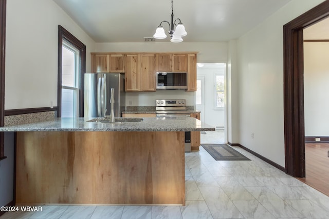 kitchen featuring decorative light fixtures, stainless steel appliances, an inviting chandelier, and stone countertops