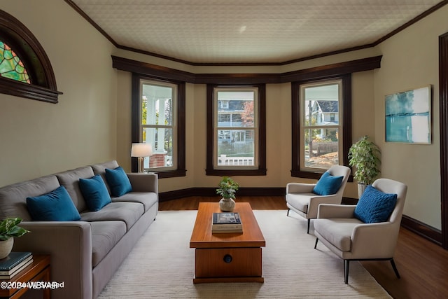 living room with light hardwood / wood-style flooring and ornamental molding