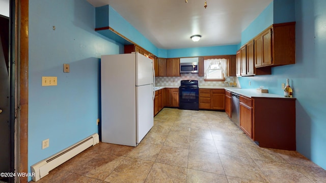 kitchen with tasteful backsplash, a baseboard radiator, and appliances with stainless steel finishes