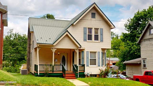 918 Allegheny St, Jersey Shore, PA 17740 - view of front facade with a porch, a front lawn, and metal roof