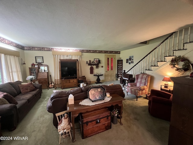 carpeted living room featuring a textured ceiling