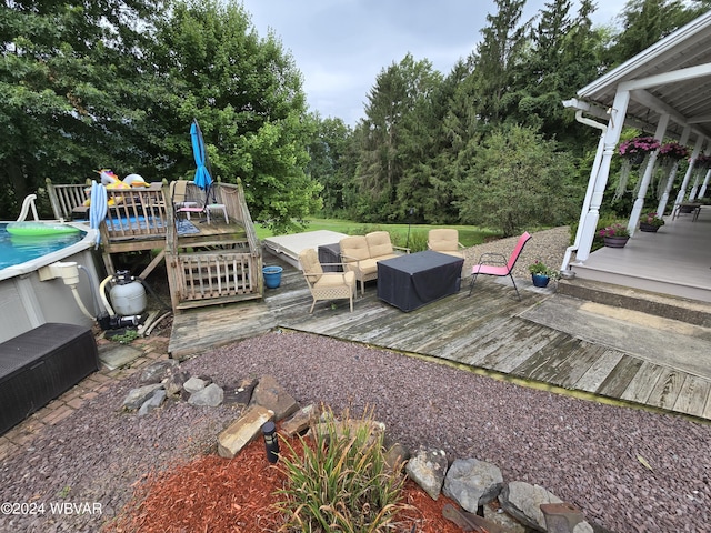 wooden terrace featuring an outdoor living space