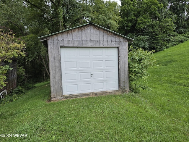 garage with a yard